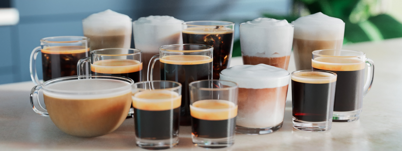 Various coffee drinks in clear glasses, showing a variety of coffee options.