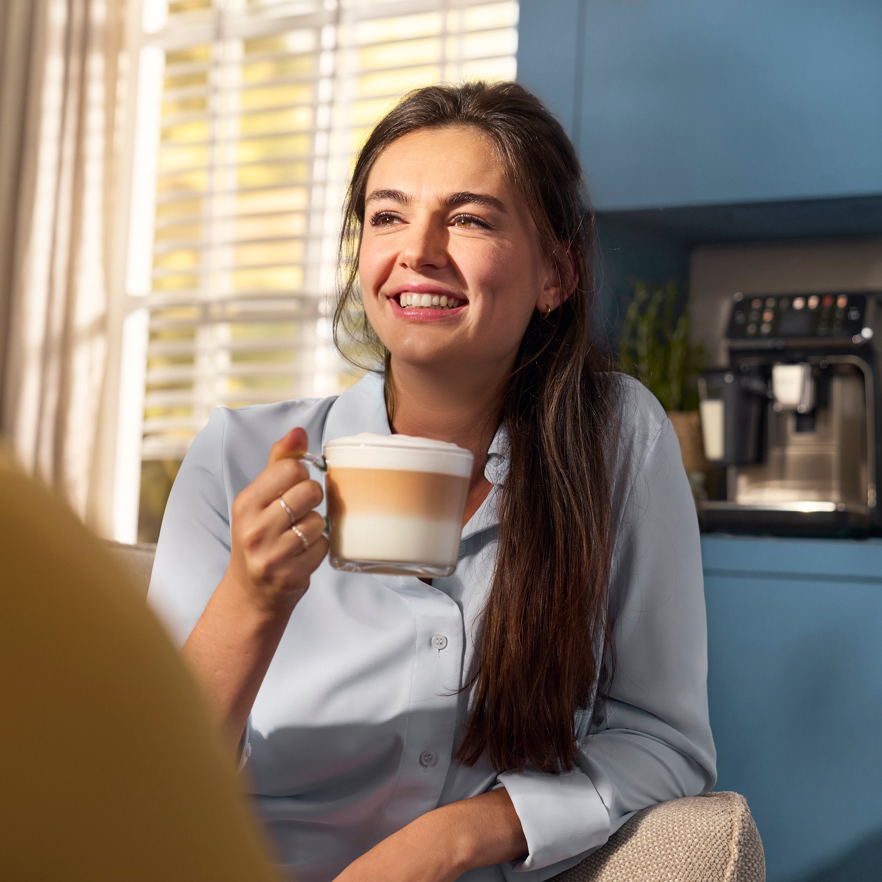 Woman drinking coffee.