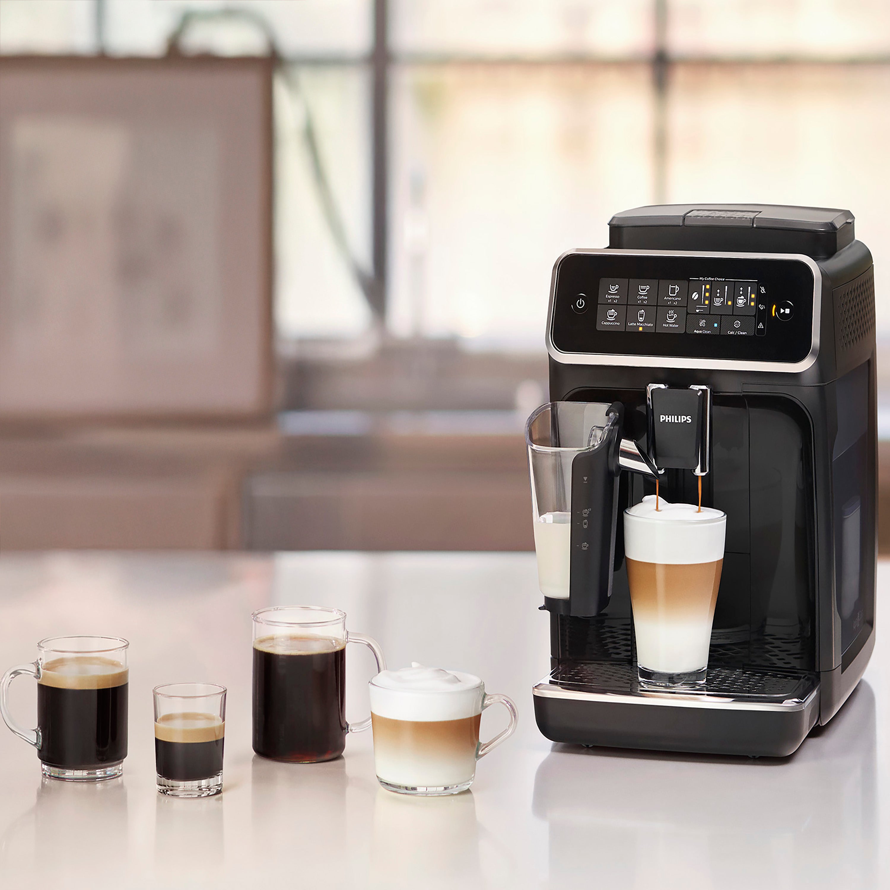 Philips coffee machine with various coffee types on a table