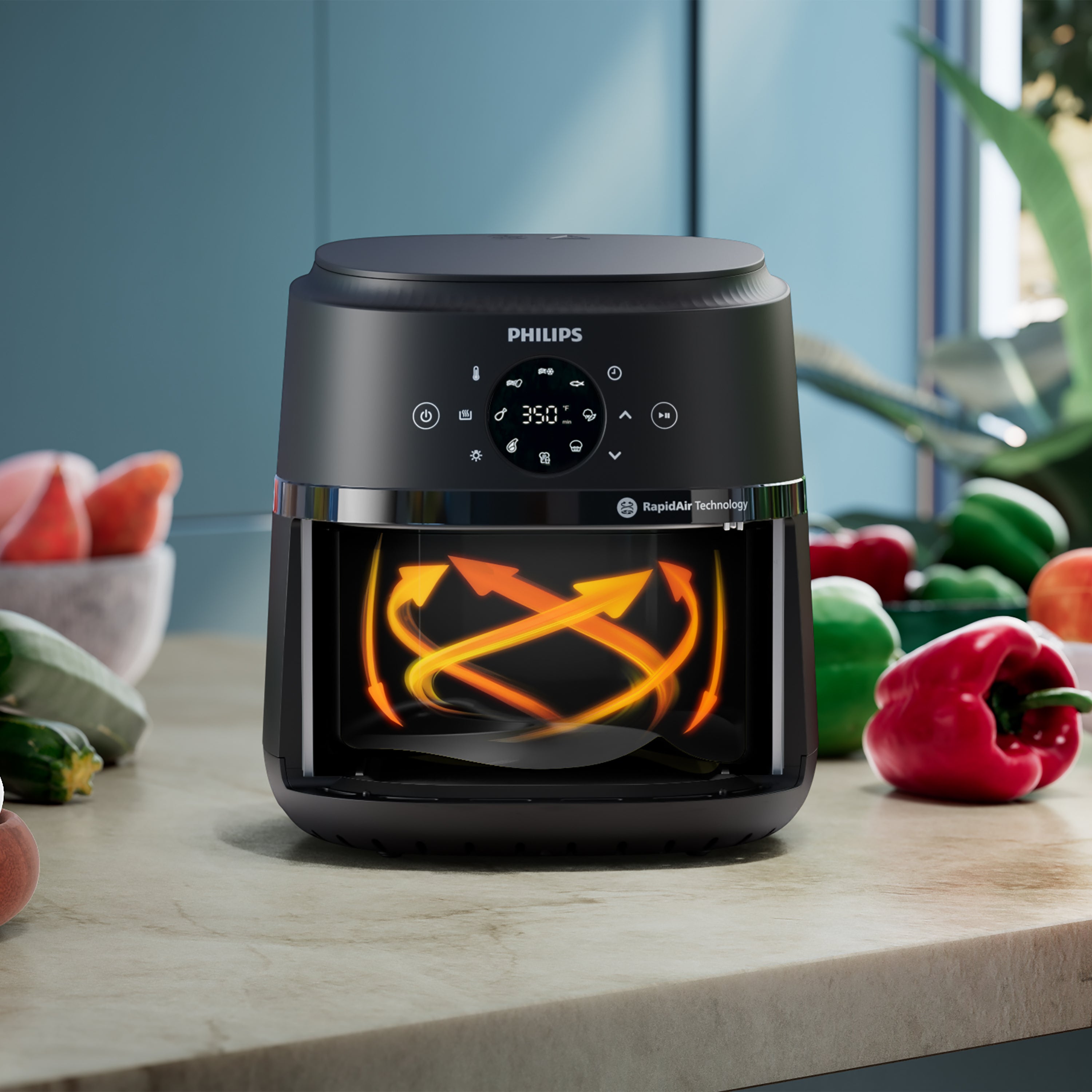 Philips air fryer on a kitchen counter with vegetables in the background