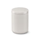 White cylindrical container with lid on a white background