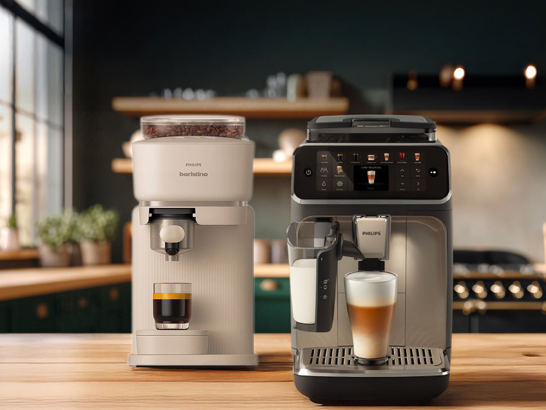 Two coffee machines on a kitchen counter with cups of coffee.