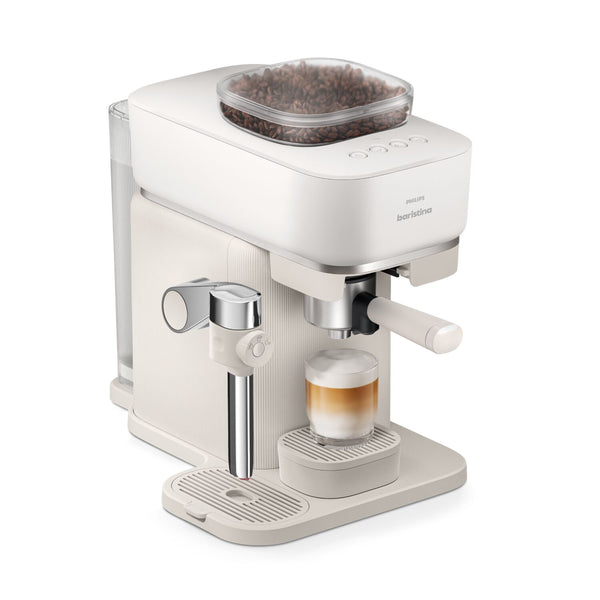 Philips Baristina Latte espresso machine with a glass of coffee on a white background
