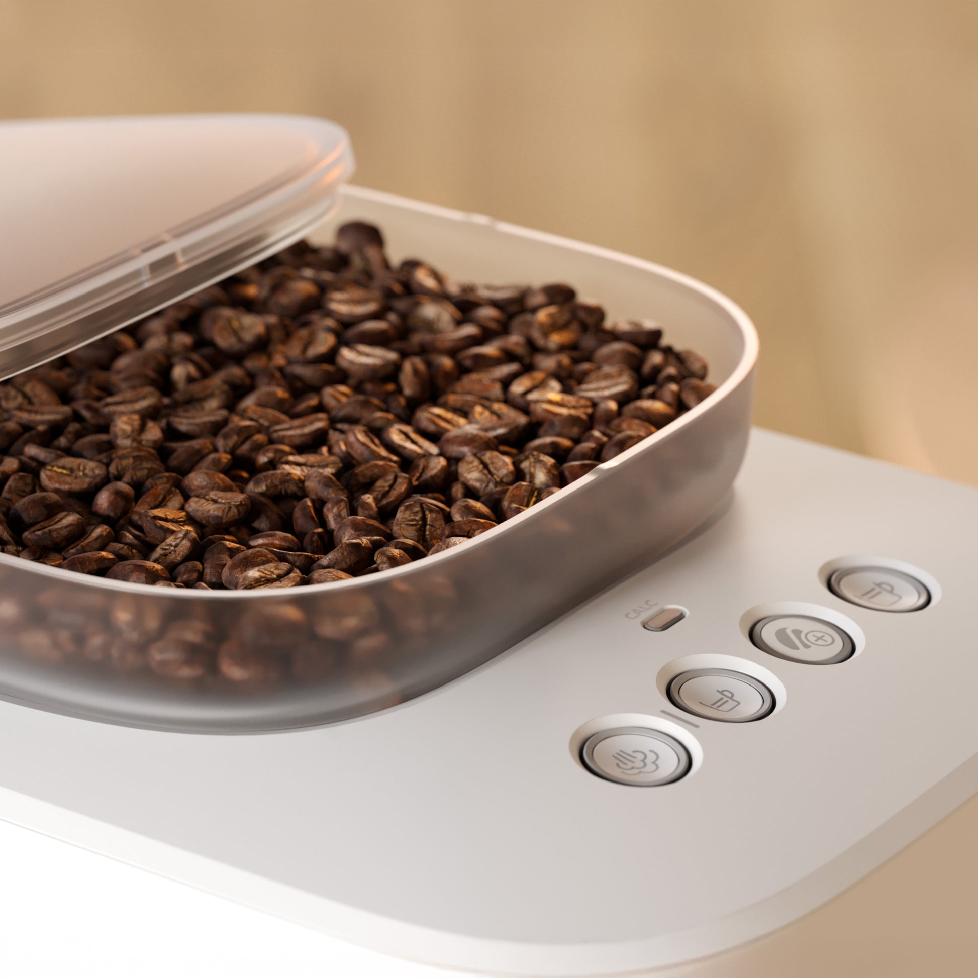 Coffee grinder with coffee beans inside on a beige background