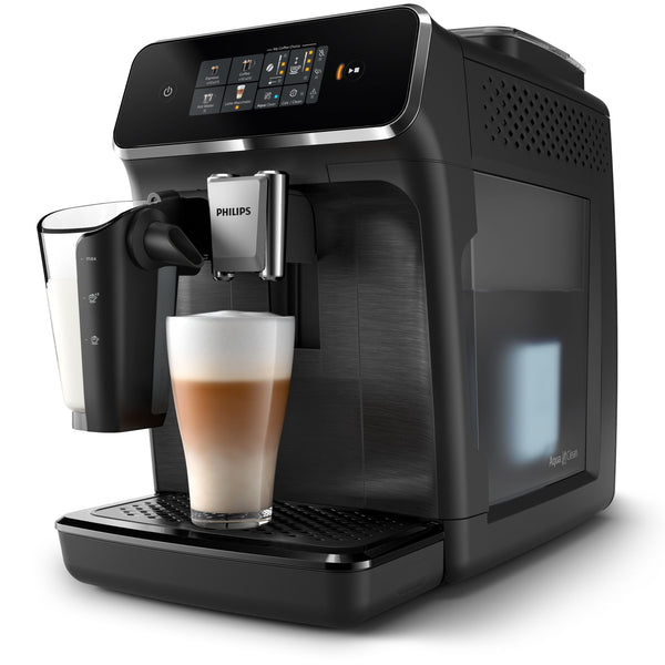 Philips coffee machine dispensing a latte into a glass on a white background