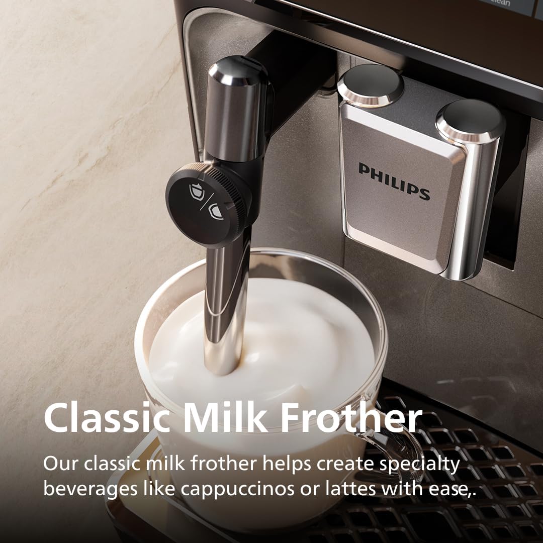 Philips milk frother in action with a bowl of frothed milk, on a kitchen counter.