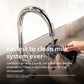 LatteGo milk system being cleaned under a faucet with text about its cleaning efficiency.
