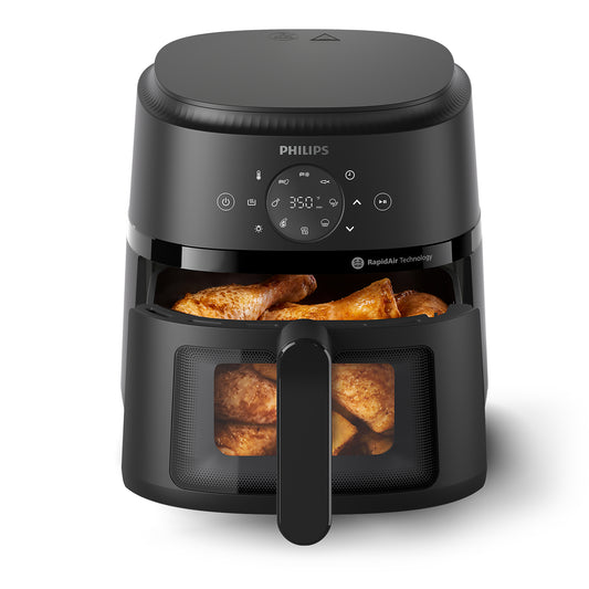 Philips air fryer with food inside on a white background