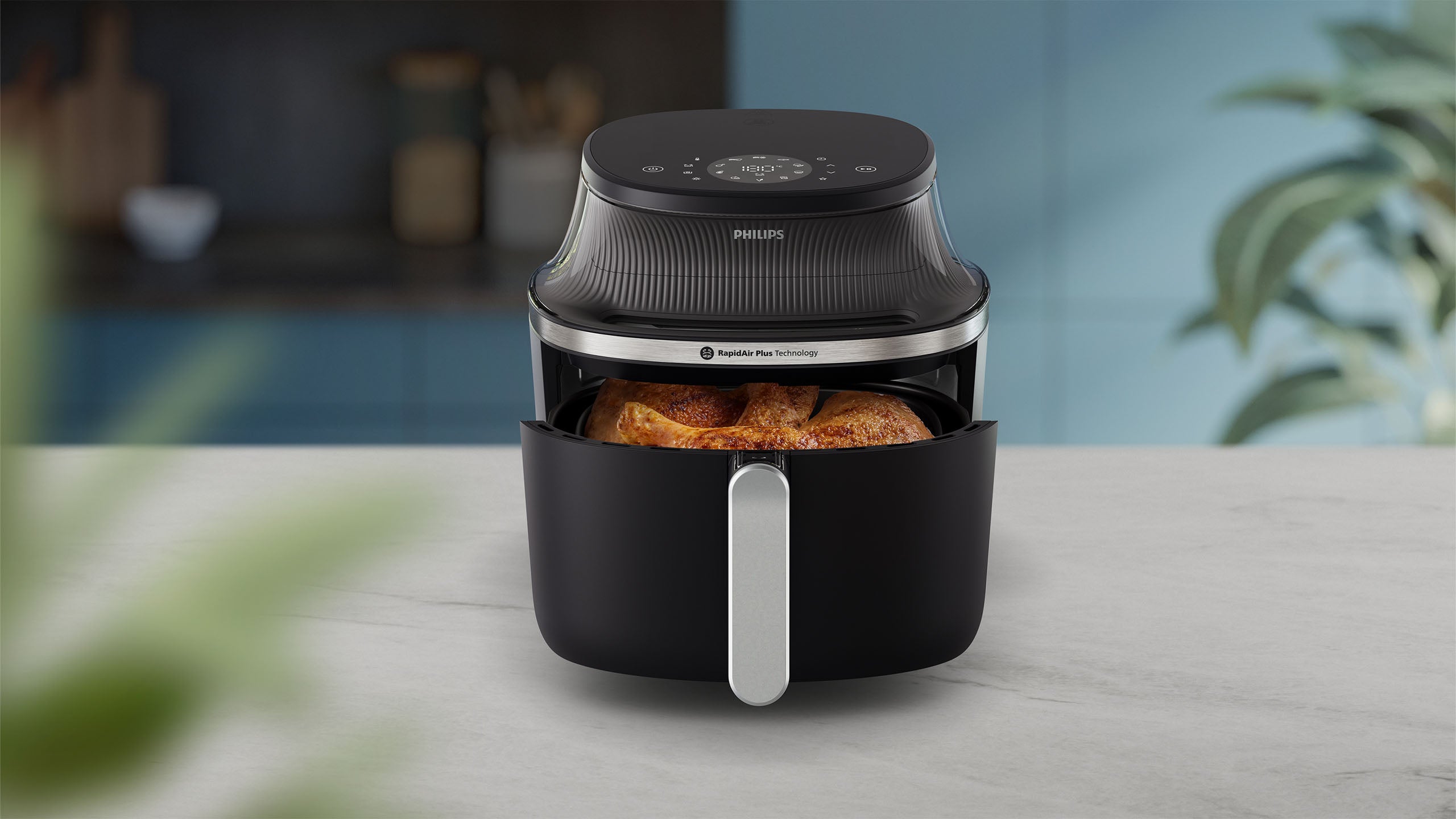 Philips Airfryer 3000 Series cooks chicken. 