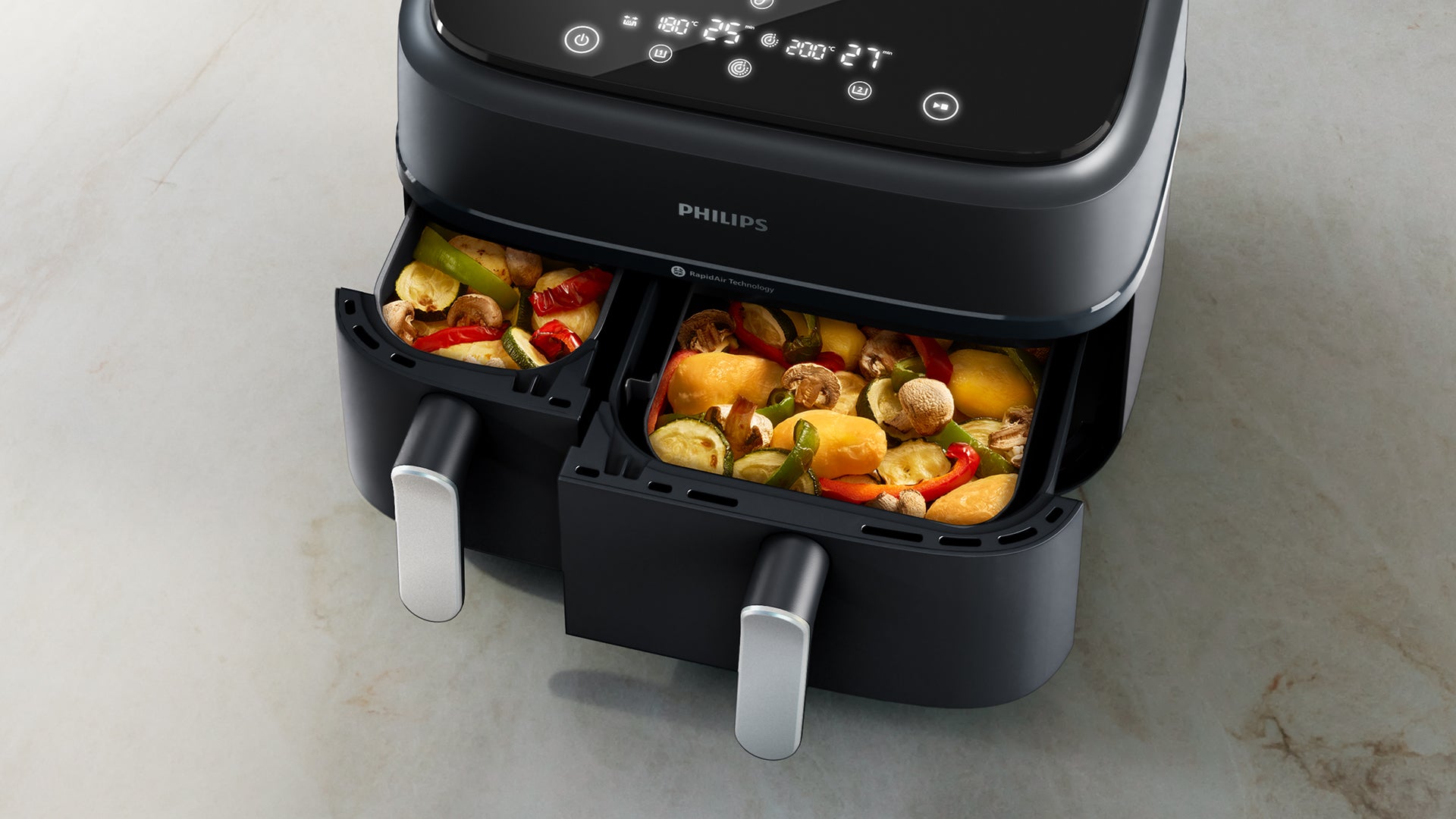 Philips Dual Basket cooking a variety of vegetables. 