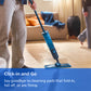 A person mops a light wood floor with a blue and black steam mop in a living room. A blue banner at the bottom reads 'Click-in and Go Say goodbye to cleaning pads that fold-in, fall off, or are flimsy.