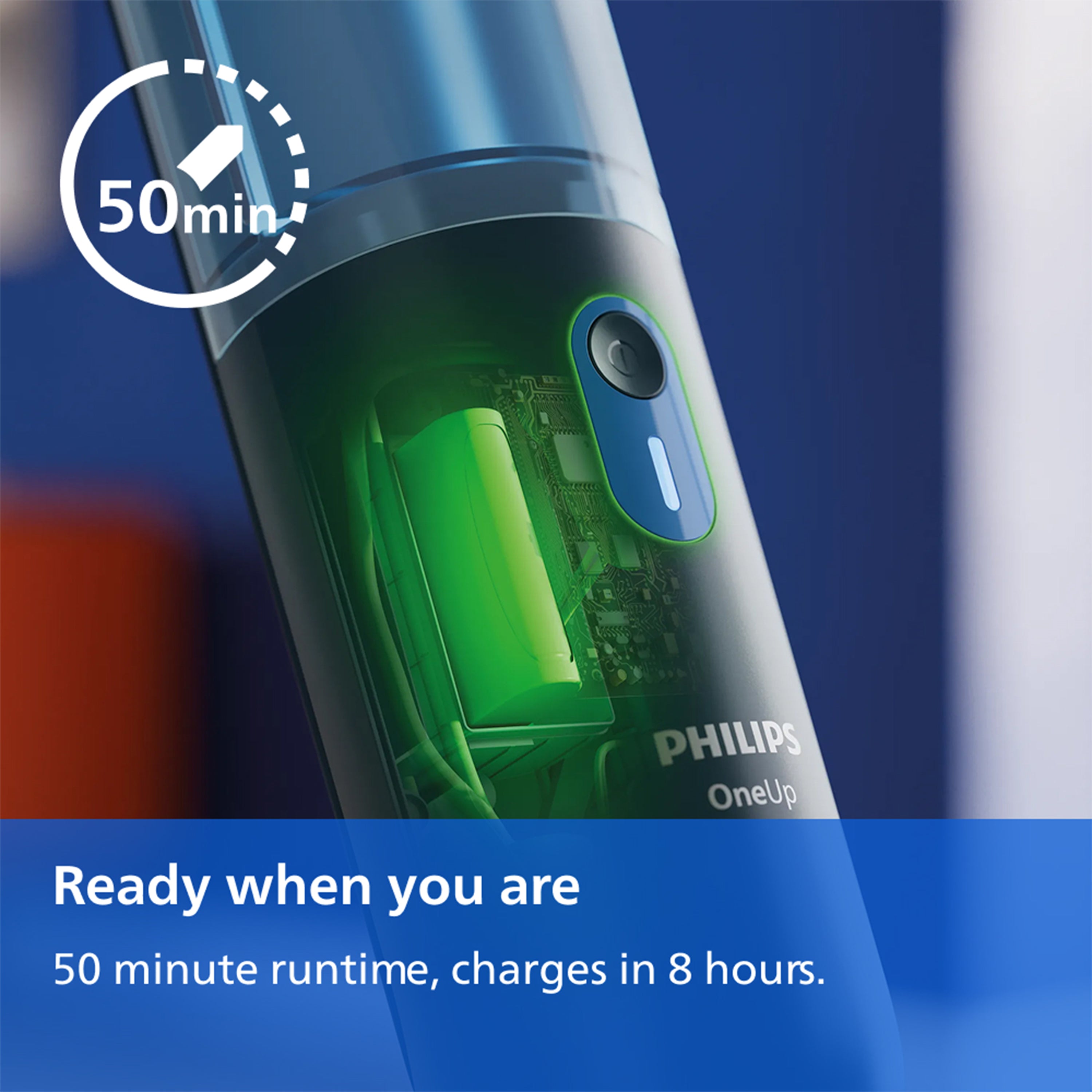 Philips OneUp vacuum cleaner close-up showing a transparent green battery compartment and a blue charging port cover, with promotional text reading '50 min' and 'Ready when you are, 50 minute runtime, charges in 8 hours.'.
