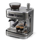 Silver espresso machine with three black cups on a white background