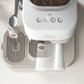 Baristina Latte machine with bean compartment and brewing spout on a light background