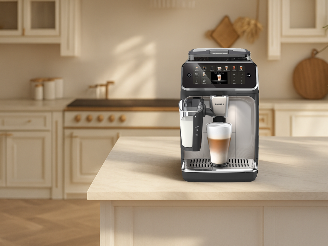 Philips coffee machine sitting on countertop in a kitchen setting.