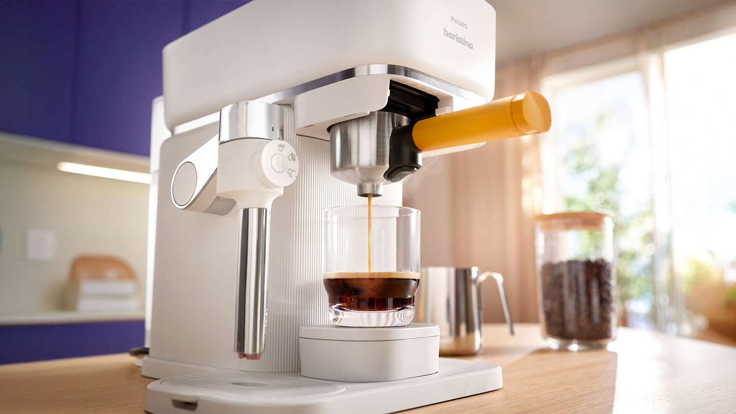 Baristina Latte espresso machine making coffee in a kitchen setting