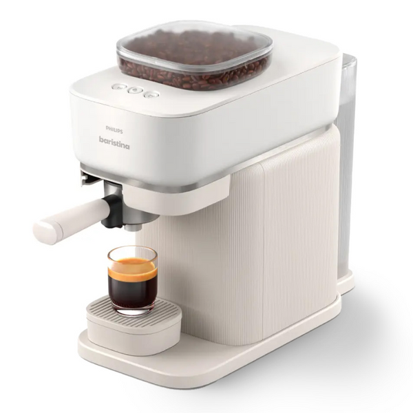 Philips Baristina espresso machine with bean hopper, making espresso in a glass.