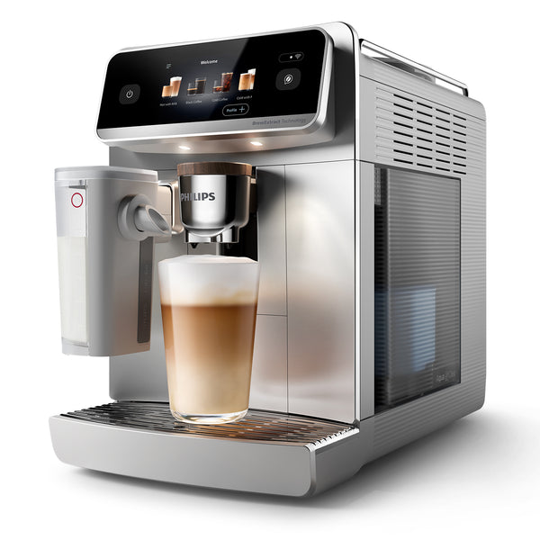 Philips coffee machine dispensing a cappuccino into a glass on a white background